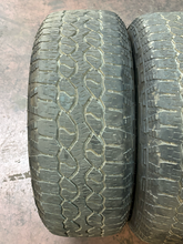 Load image into Gallery viewer, Set of Used '05-'26 Ford F150 Gloss Black Wheels 275/65R18 Goodyear AT Tires LT
