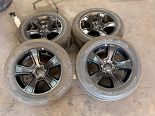 Load image into Gallery viewer, Set of Used Black '19-'26 RAM 1500 OEM Wheels 275/55R20 Bridgestone HL Tires LT
