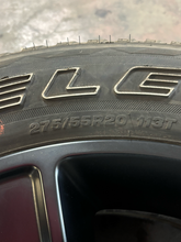 Load image into Gallery viewer, Set of 4 Used 20" Black '19-'26 RAM 1500 OEM Wheels 275/55R20 Bridgestone H/L LT
