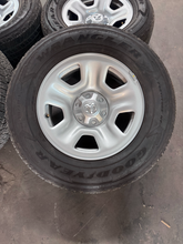 Load image into Gallery viewer, OEM '19-'26 RAM 1500 OEM Steel Used Wheels on 275/65R18 Goodyear H/T Tires LT
