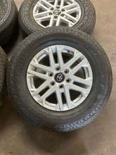 Load image into Gallery viewer, OEM '22-'26 Toyota Tundra 18" Silver Wheels 265/70R18 Bridgestone Dueler H/T LT
