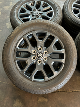 Load image into Gallery viewer, OEM '22-'26 Toyota Tundra 20" Dark Charcoal Used Wheels 265/60R20 Bridgestone LT
