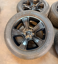 Load image into Gallery viewer, Set of Used 20" Matte Black '19-'26 RAM 1500 OEM Wheels 275/55R20 Bridgestone LT
