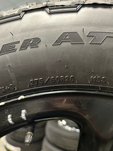 Load image into Gallery viewer, OEM '99-'26 Chevrolet Tahoe Suburban Black Steel Wheels 275/60R20 Goodyear Tires
