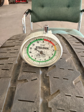 Load image into Gallery viewer, Set of Used Black '19-'26 RAM 1500 OEM Wheels 275/55R20 Bridgestone HL Tires LT

