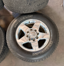 Load image into Gallery viewer, Set of Used 20" Polished '11-'26 GMC Sierra 2500 5503 Rims 275/65R20 Michelin LT
