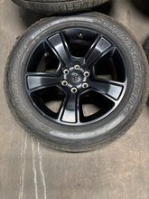 Load image into Gallery viewer, Set of 4 Used OEM Matte Black &#39;19-&#39;25 RAM 1500 Wheels on 275/55R20 Alenza H/L LT
