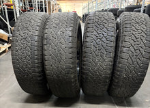 Load image into Gallery viewer, Set of 4 Used &#39;11-&#39;24 GMC Sierra 2500 Black Milled Rims 275/65R20 Goodyear AT LT
