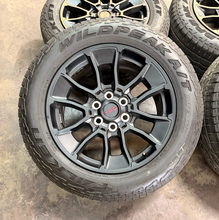 Load image into Gallery viewer, Set of Used '22-'26 Toyota Tundra OEM TRD Black Wheels on 265/60R20 Falken AT LT
