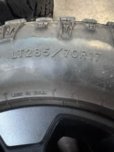 Load image into Gallery viewer, OEM '05-'26 RAM 2500 Power Wagon Used Black Rims 285/70R17 Goodyear Duratrac LT
