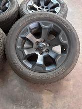 Load image into Gallery viewer, OEM '19-'26 RAM 1500 20" Matte Black Used Wheels on 275/55R20 Bridgestone HL LT
