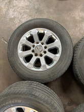 Load image into Gallery viewer, OEM '05-'26 RAM 2500 20" Polished Used Wheels on 285/60R20 Michelin Defender LT
