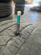 Load image into Gallery viewer, OEM '19-'26 RAM 1500 OEM Black Used Wheels on 275/55R20 Bridgestone HL Tires LT
