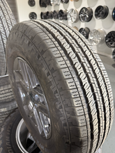 Load image into Gallery viewer, OEM '20-'26 Jeep Gladiator 17" Dark Charcoal Wheels 245/75R17 Nexen Roadian HTX2
