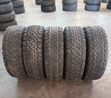 Load image into Gallery viewer, OEM '07-'26 Jeep Wrangler 17" Black Used Rims 285/70R17 BFGoodrich AT Tires LT
