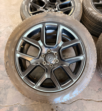 Load image into Gallery viewer, Set of 4 Used Black '19-'26 RAM 1500 22" Wheels 285/45R22 Pirelli All Season LT
