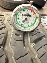 Load image into Gallery viewer, Set of Used '22-'26 Toyota Tundra OEM TRD Black Wheels on 265/60R20 Falken AT LT

