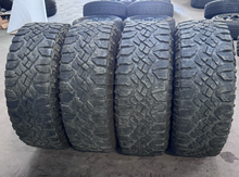 Load image into Gallery viewer, OEM '05-'26 RAM 2500 Power Wagon Used Black Rims 285/70R17 Goodyear Duratrac LT
