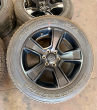 Load image into Gallery viewer, Set of Used Black '19-'26 RAM 1500 OEM Wheels 275/55R20 Bridgestone HL Tires LT
