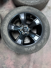 Load image into Gallery viewer, OEM '19-'26 RAM 1500 OEM Black Used Wheels on 275/55R20 Bridgestone HL Tires LT
