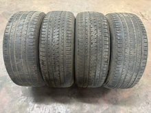 Load image into Gallery viewer, Set of 4 Used 20" Black '19-'26 RAM 1500 OEM Wheels 275/55R20 Bridgestone H/L LT
