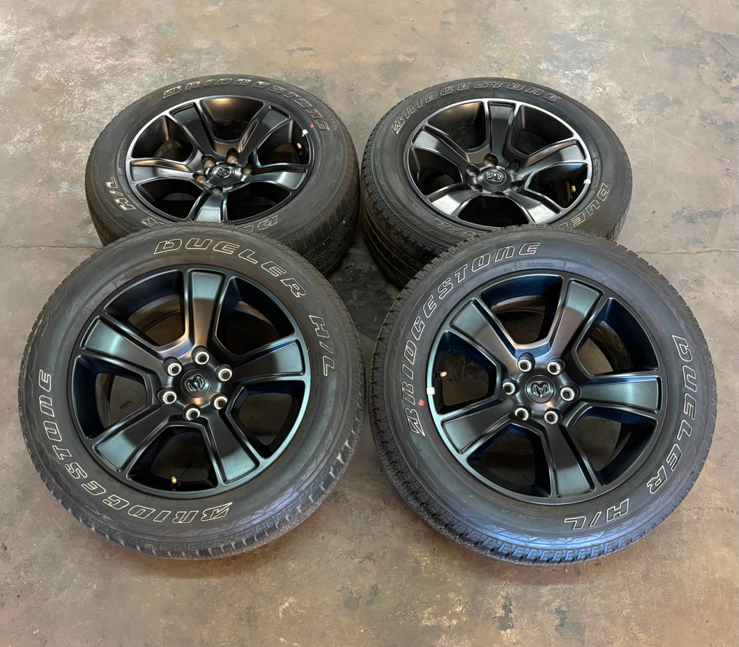 Set of Used '19-'25 RAM 1500 Black OEM Wheels on 275/55R20 Bridgestone Tires LT