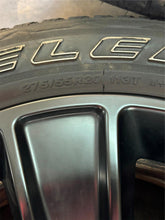 Load image into Gallery viewer, Set of Used &#39;19-&#39;25 RAM 1500 Black OEM Wheels on 275/55R20 Bridgestone Tires LT
