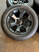 Load image into Gallery viewer, Set of 4 Used OEM &#39;19-&#39;25 RAM 1500 Big Horn Black Wheels on 275/55R20 Tires LT
