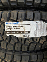Load image into Gallery viewer, Set of OEM 17" '05-'26 RAM 2500 3500 Power Wagon Rims 35/12.50R17 Toyo RT Tires
