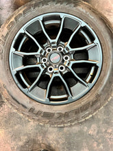 Load image into Gallery viewer, Set of Used &#39;22-&#39;25 Toyota Tundra TRD Black Wheels on 265/60R20 Falken Tires LT

