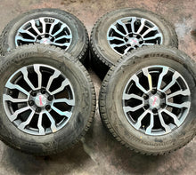 Load image into Gallery viewer, Set of Four Used OEM &#39;00-&#39;25 GMC Sierra 1500 AT4 Wheels 275/65R18 Bridgestone LT
