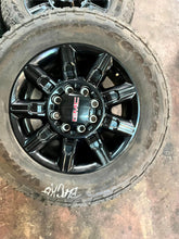 Load image into Gallery viewer, Set of 4 Used OEM &#39;11-&#39;25 GMC Sierra 2500 3500 Black Rims 275/65R20 Goodyear LT

