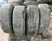 Load image into Gallery viewer, Set of 4 Used OEM &#39;11-&#39;25 GMC Sierra 2500 3500 Black Rims 275/65R20 Goodyear LT
