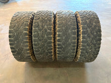 Load image into Gallery viewer, Set of Used '19-'26 RAM 1500 Black Rims 275/70R18 Goodyear Wrangler Duratrac LT
