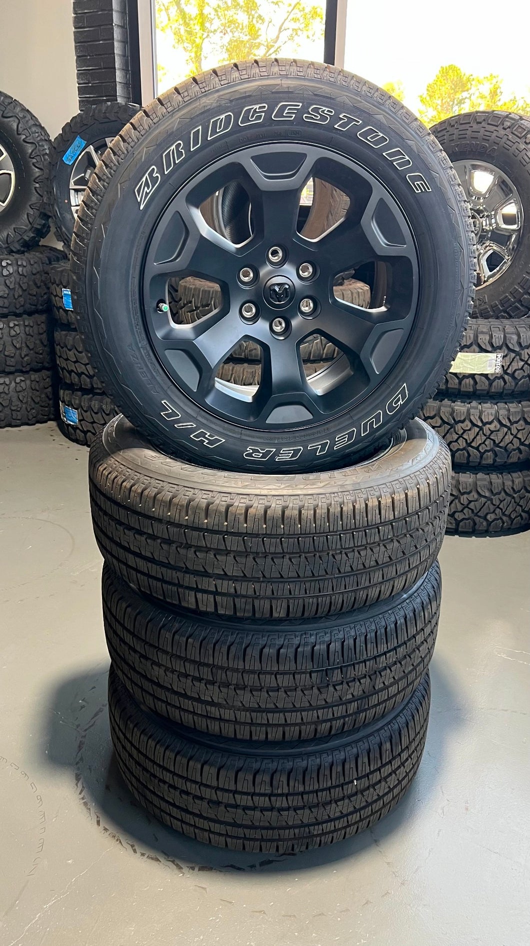 Set of Four OEM Black '19-'25 RAM 1500 Wheels 275/55R20 Bridgestone Alenza Tires