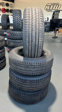 Load image into Gallery viewer, Set of Four OEM Black &#39;19-&#39;25 RAM 1500 Wheels 275/55R20 Bridgestone Alenza Tires
