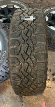 Load image into Gallery viewer, Set of Four Used 18&quot; &#39;19-&#39;24 Dodge RAM 1500 Rims on 275/70R18 Goodyear Tires LT
