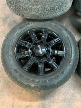 Load image into Gallery viewer, Set of 4 Used OEM &#39;11-&#39;25 GMC Sierra 2500 3500 Black Wheels 275/65R20 Tires LT
