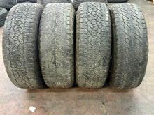 Load image into Gallery viewer, Set of 4 Used OEM &#39;11-&#39;25 GMC Sierra 2500 3500 Black Wheels 275/65R20 Tires LT
