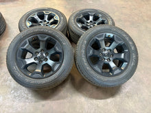 Load image into Gallery viewer, Set of 4 Used OEM Black &#39;19-&#39;25 RAM 1500 Rims 275/55R20 Bridgestone RWL Tires LT
