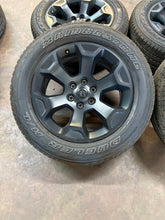 Load image into Gallery viewer, Set of 4 Used OEM Black &#39;19-&#39;25 RAM 1500 Rims 275/55R20 Bridgestone RWL Tires LT
