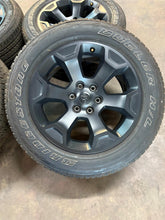 Load image into Gallery viewer, Set of 4 Used OEM Black &#39;19-&#39;25 RAM 1500 Rims 275/55R20 Bridgestone RWL Tires LT
