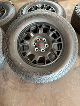 Load image into Gallery viewer, Set of Four OEM &#39;24-&#39;25 Toyota Tacoma TRD Wheels 265/70R18 Falken Wildpeak AT LT
