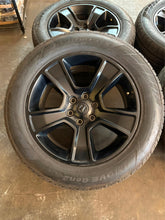 Load image into Gallery viewer, Set of 4 Used Black &#39;19-&#39;25 Dodge RAM 1500 OEM Wheels 275/55R20 Ironman Tires LT
