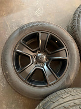 Load image into Gallery viewer, Set of 4 Used Black &#39;19-&#39;25 Dodge RAM 1500 OEM Wheels 275/55R20 Ironman Tires LT
