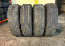Load image into Gallery viewer, Set of 4 Used 18&quot; &#39;05-&#39;25 Ford F-150 Wheels on 275/65R18 Michelin Primacy XC LT

