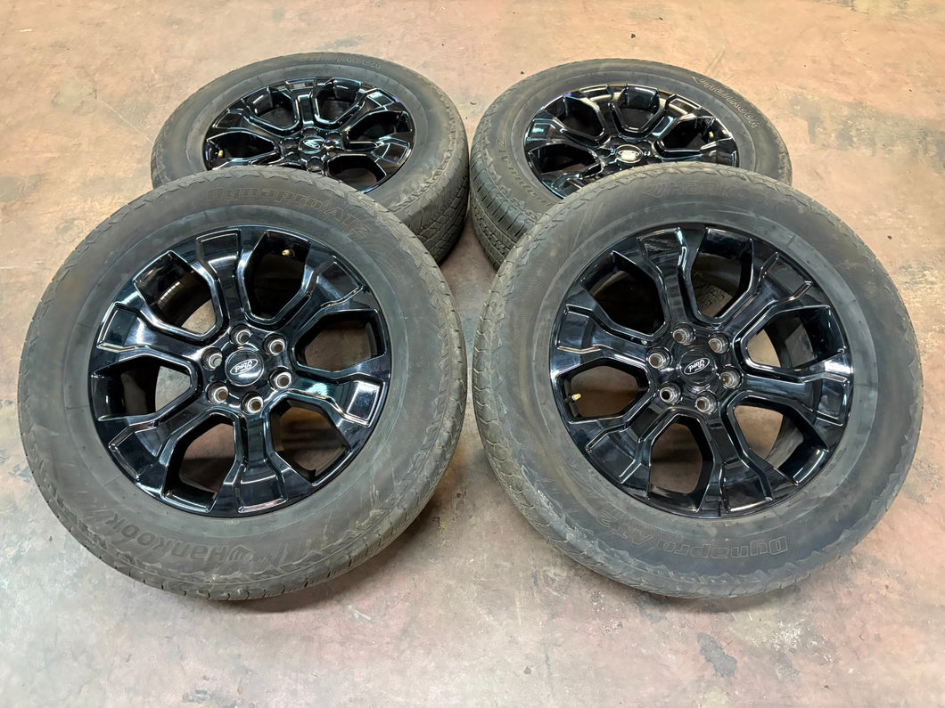 Set of Used '05-'25 Ford F150 Black Wheels on 275/60R20 Hankook Dynapro Tires LT