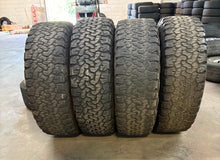 Load image into Gallery viewer, Set of Used &#39;11-&#39;25 Chevy Silverado 2500 3500 BLK Rims 295/65R20 BFG AT TAKO2 LT
