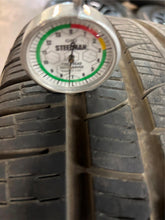 Load image into Gallery viewer, Set of Four Used Matte Black 22&quot; &#39;19-&#39;25 RAM 1500 Rims 285/45R22 Pirelli AS LT
