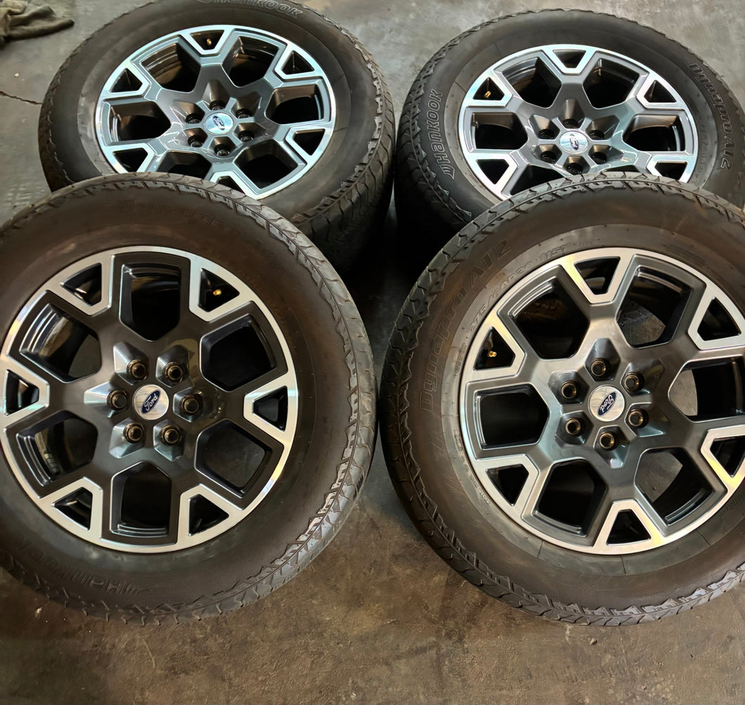 Set of Four Used '05-'25 Ford F-150 OEM Wheels 275/60R20 Hankook Dynapro AT2 LT